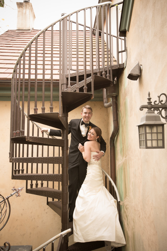 Wedding photography - bride and groom on spiral staircase at historic downtown Charlottesville bed and breakfast